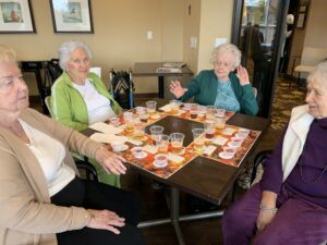 Seniors sitting around a table