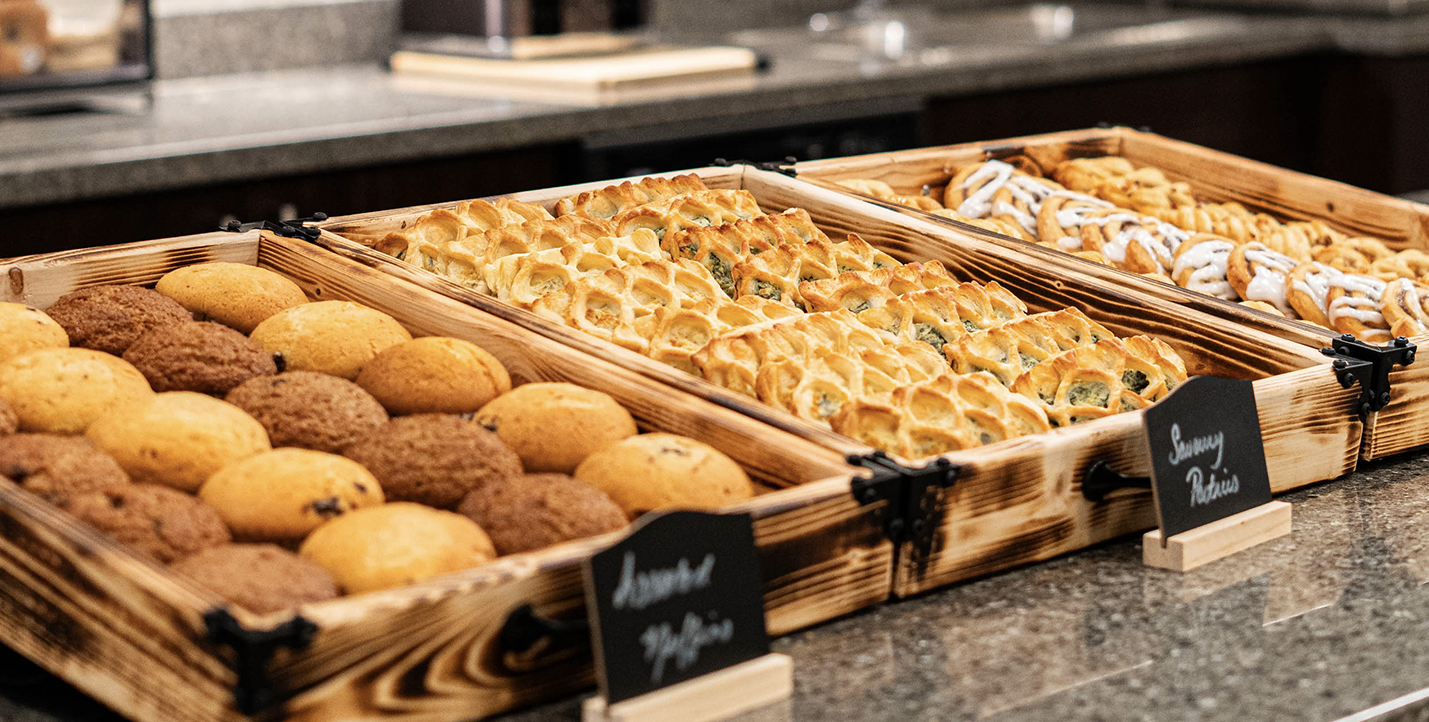 Wooden trays of pastries and baked goods
